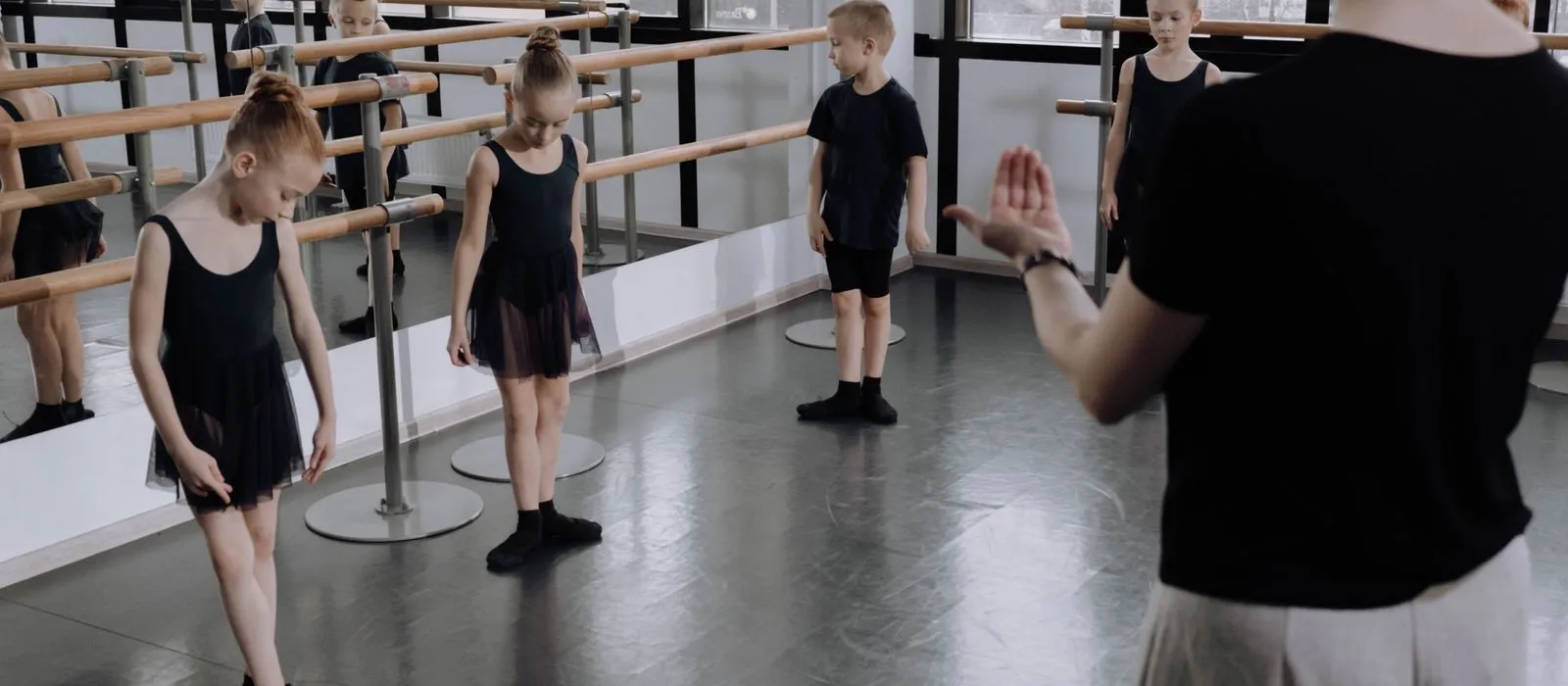 A children's ballet class practicing in a studio, dance studio web design by Designs by Delia