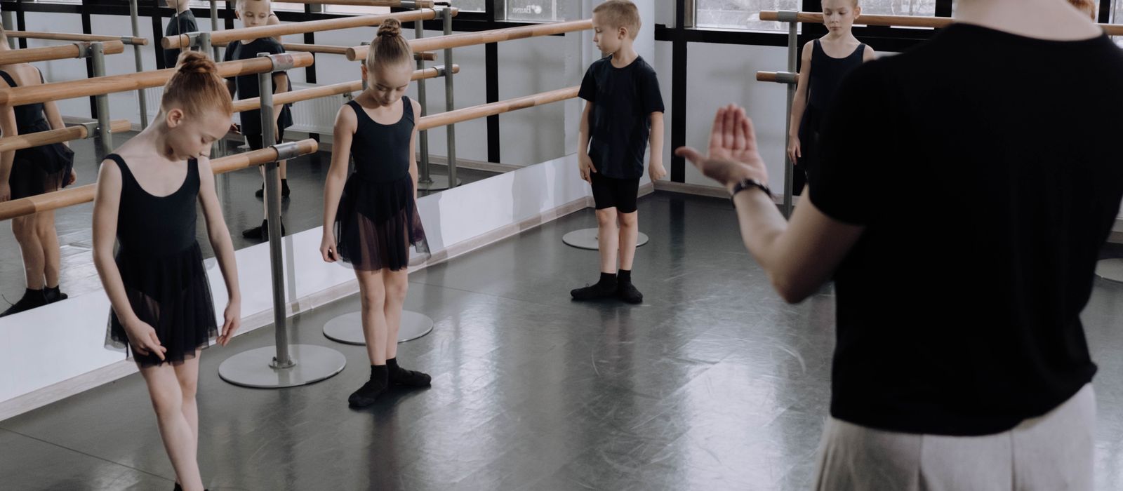 A children's ballet class practicing in a studio, dance studio web design by Designs by Delia