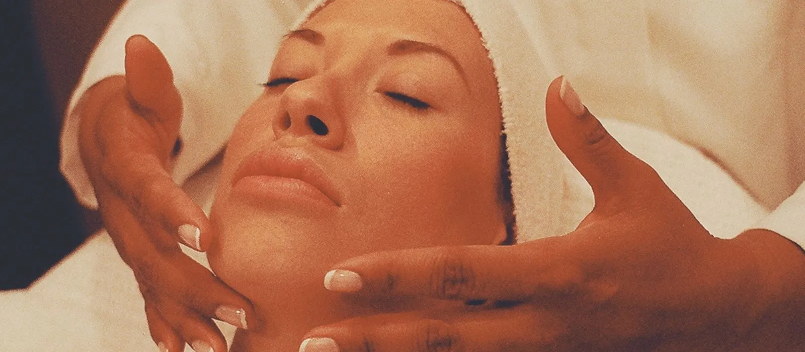 A facial treatment in progress at a spa, day spa web design by Designs by Delia