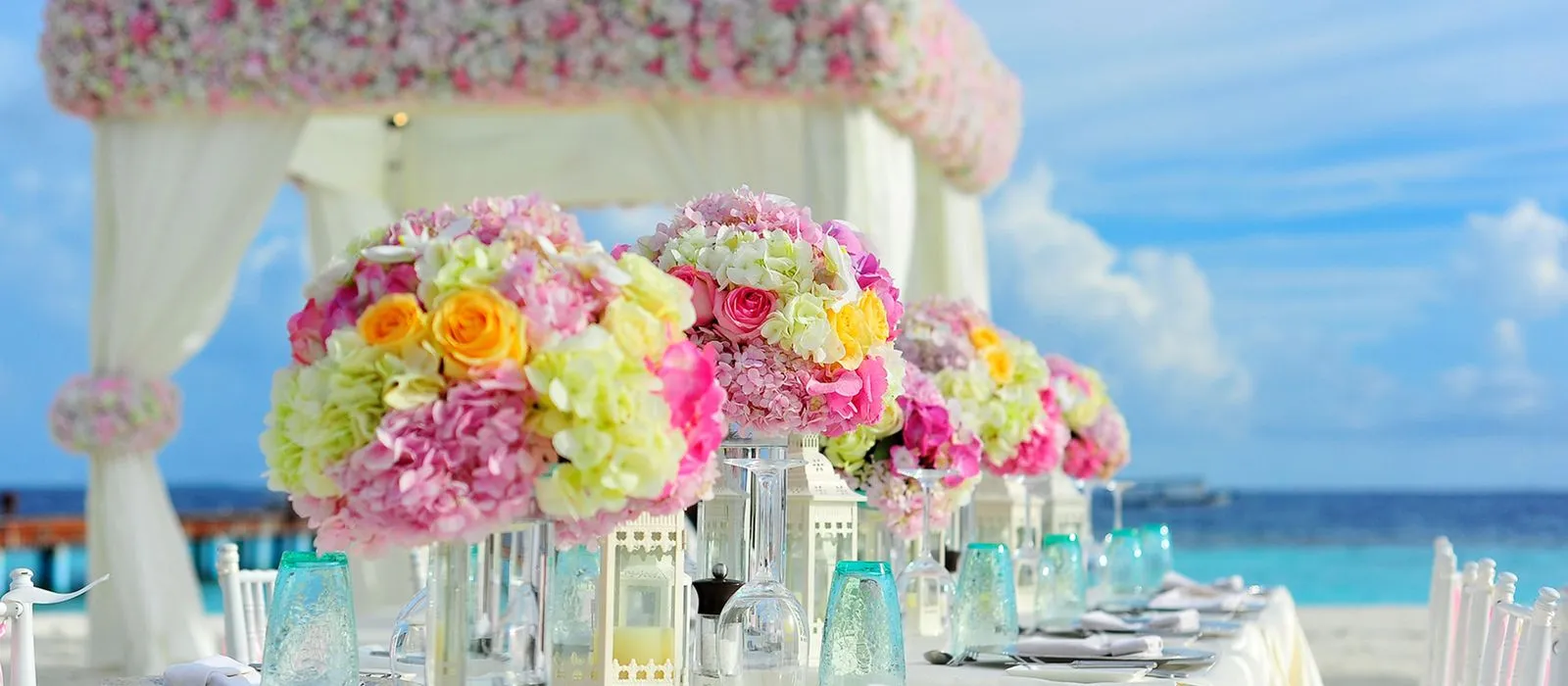An elegantly set event table at a venue, event venue web design by Designs by Delia