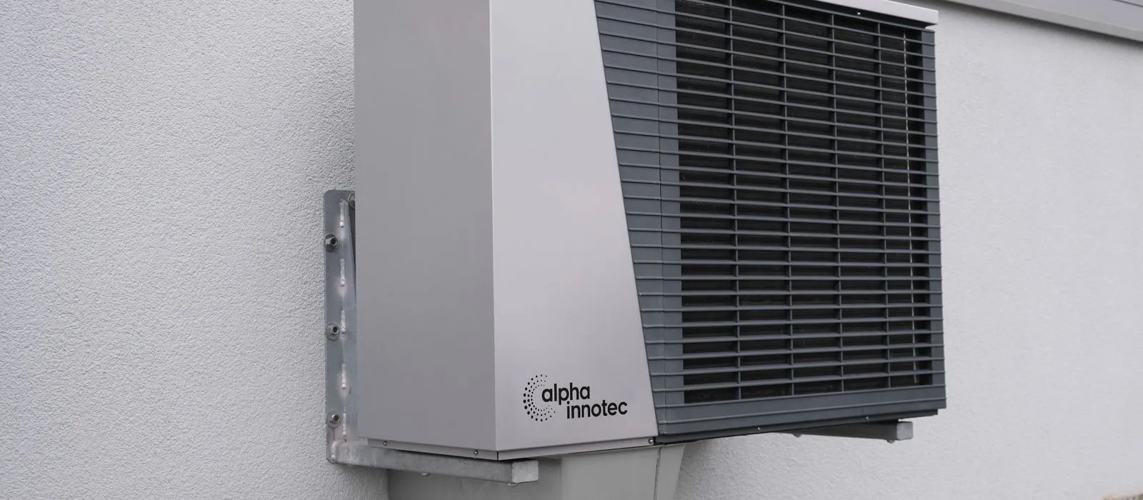 An HVAC technician servicing an air conditioning unit, HVAC web design by Designs by Delia