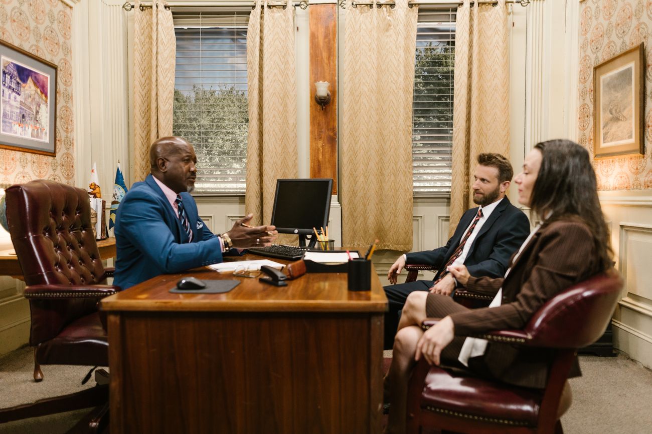 Attorneys meeting with a client