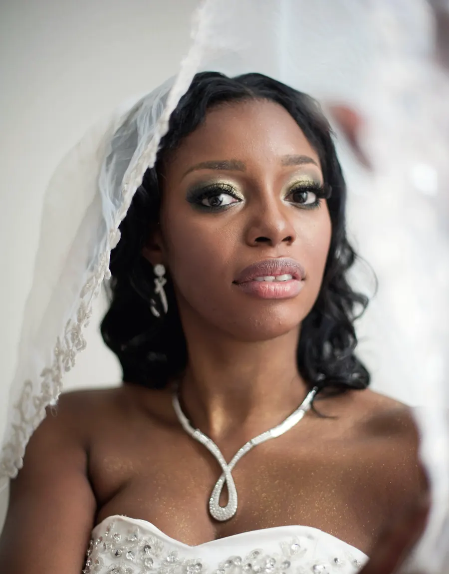Bride beneath a lace veil