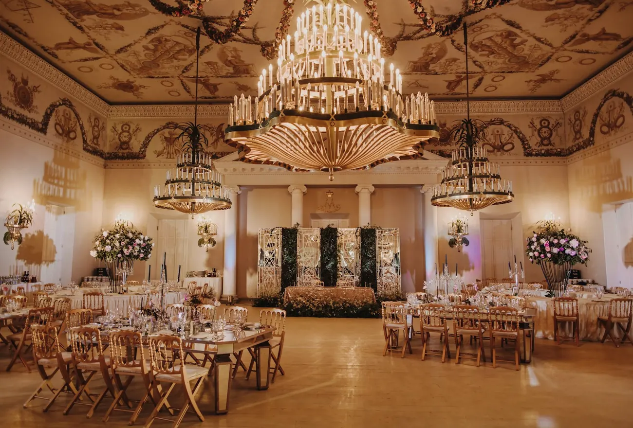 Ballroom reception beneath chandeliers