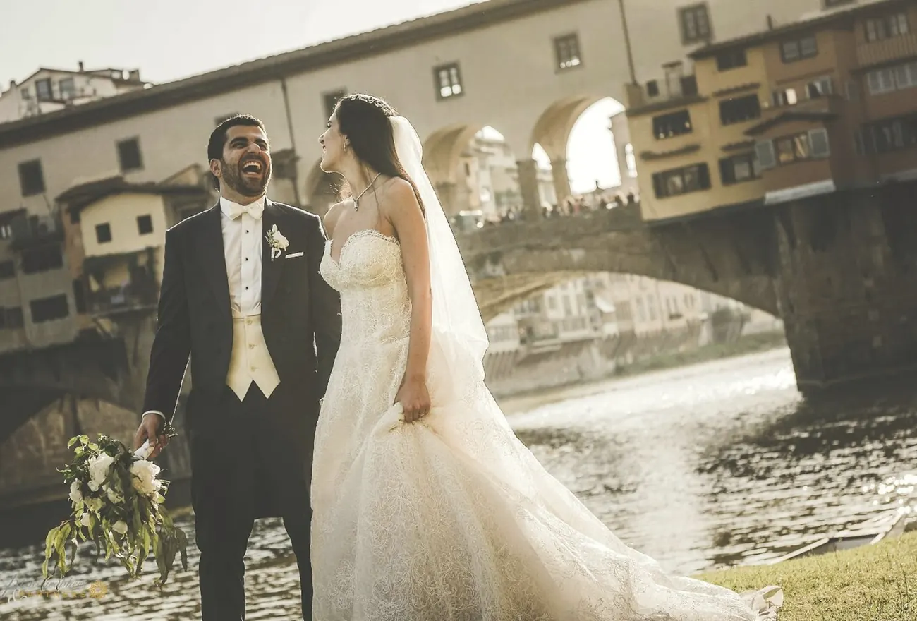 Couple walking a riverside street