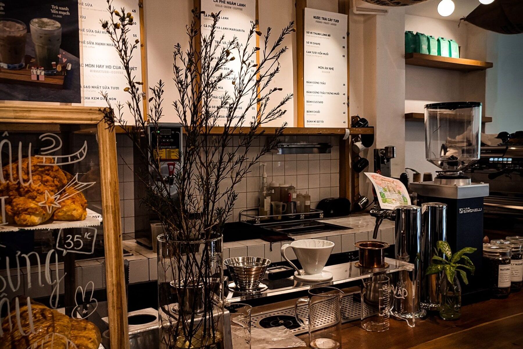 Rustic coffee shop counter with hanging lights