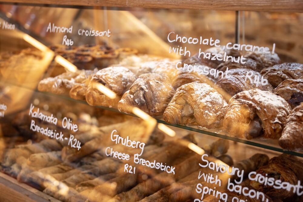 Croissants in the pastry case with handwritten labels