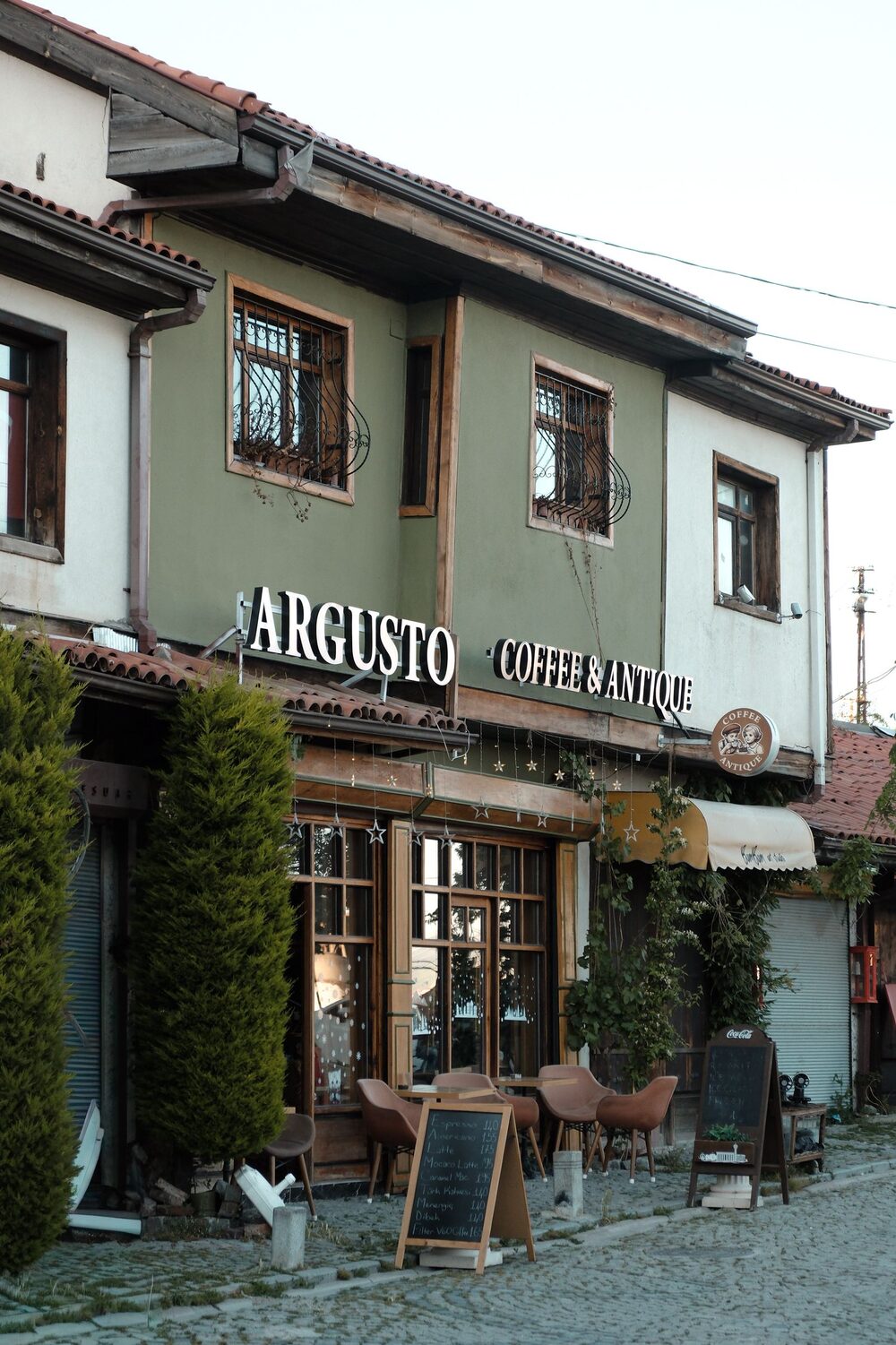 Coffee shop exterior with sidewalk seating