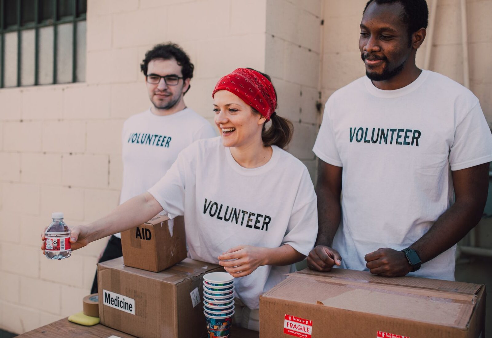 Volunteers packing food boxes together
