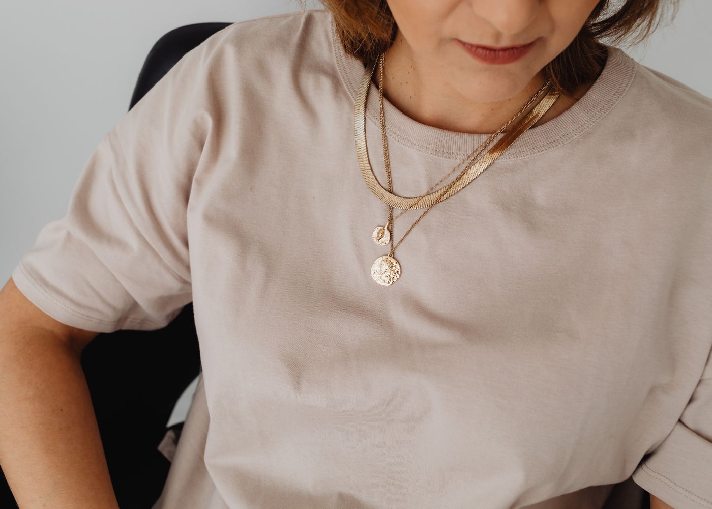 Layered gold necklaces