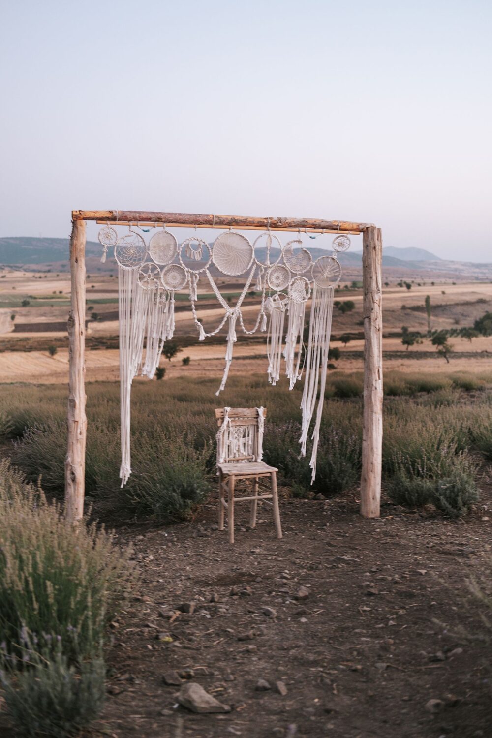 Simple wooden arbor on a hillside